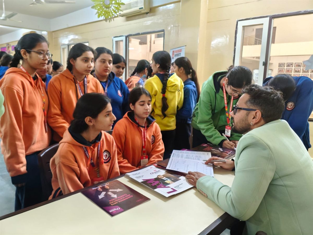 Students speaking with a counsellor during an admission session